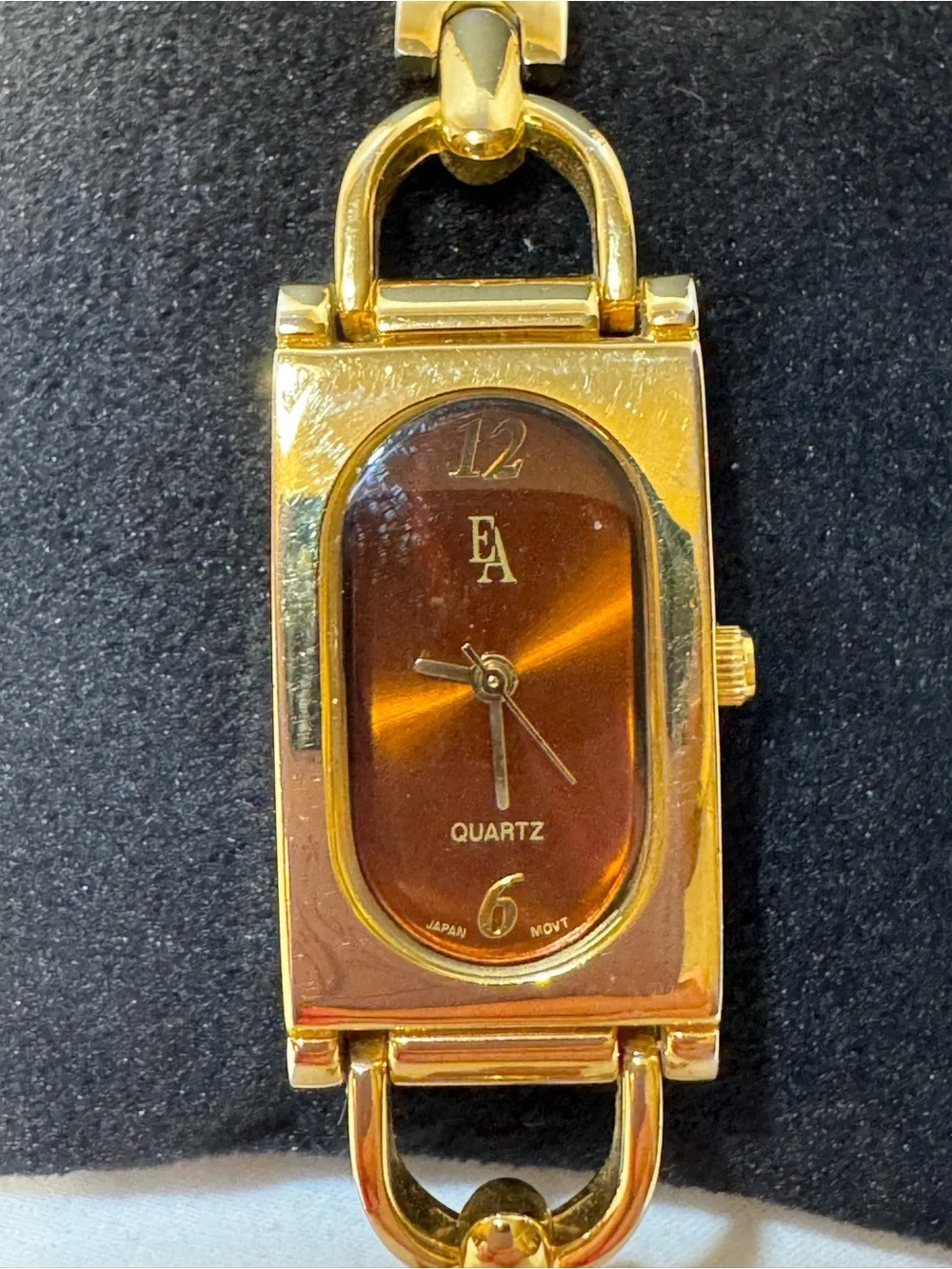 Etienne Aigner Gold Tone Bracelet Watch with Amber Dial